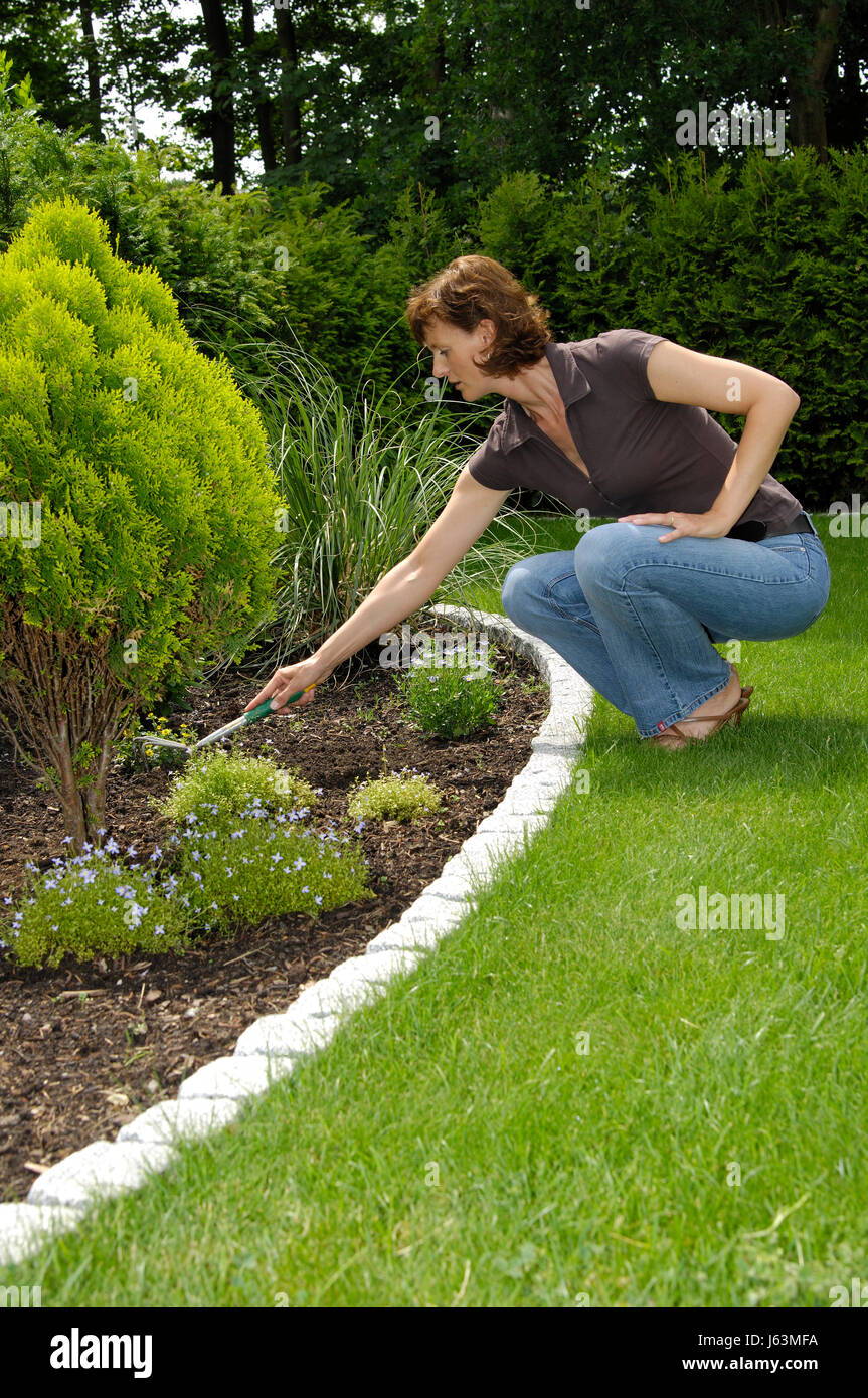 woman working in the garden Stock Photo - Alamy