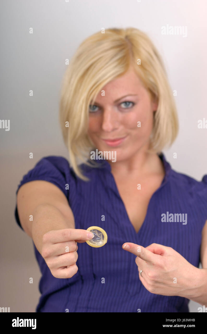 young woman with a condom Stock Photo