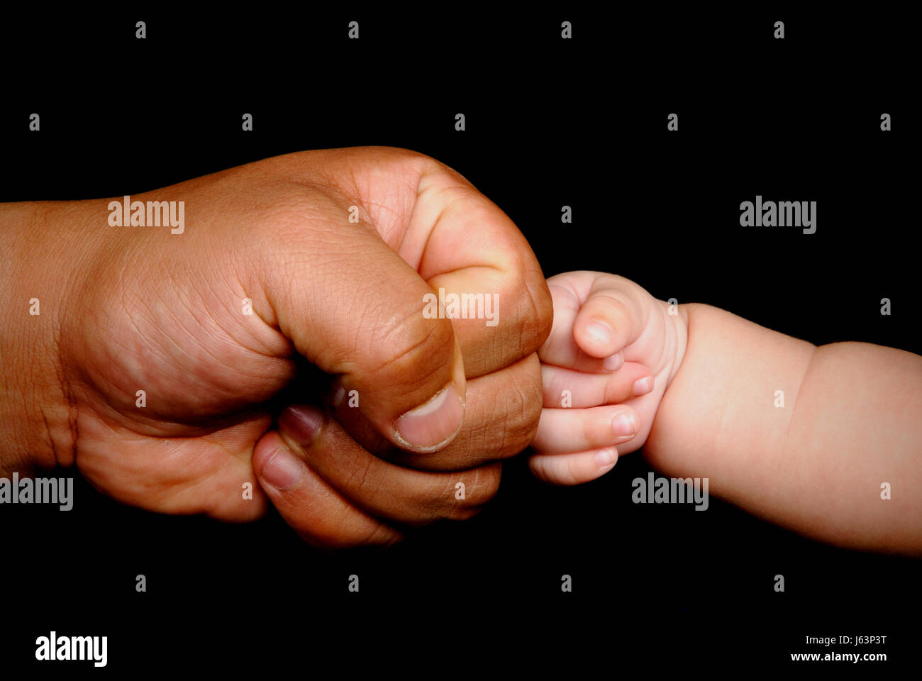 men man hand hands detail son baby fists daddies fathers child father daddy dad Stock Photo