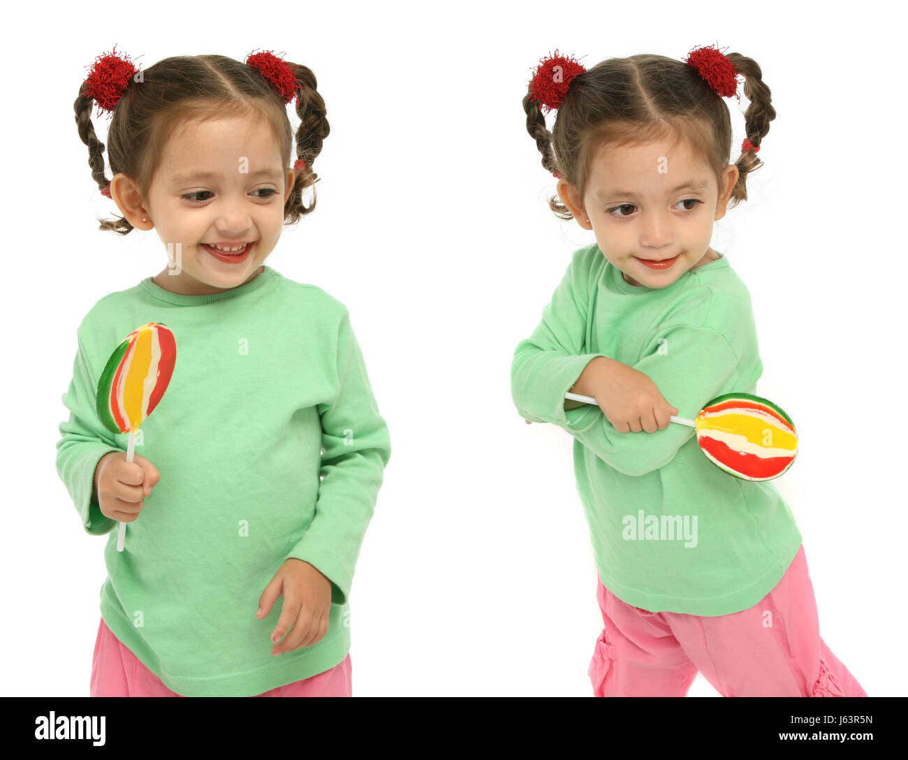 lollipop possession holding kid expressions maddening pert coquettish cute Stock Photo