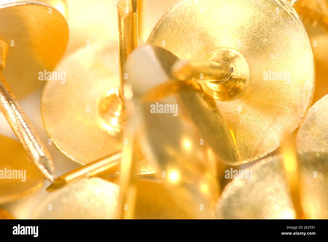 Gold thumbtacks hi-res stock photography and images - Alamy