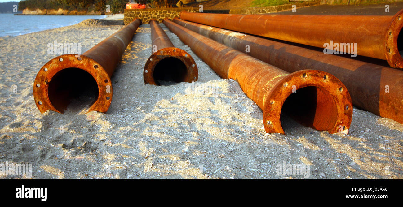 channel iron steel metal rusty sewerage drainpipe tube pipe shine shines bright Stock Photo