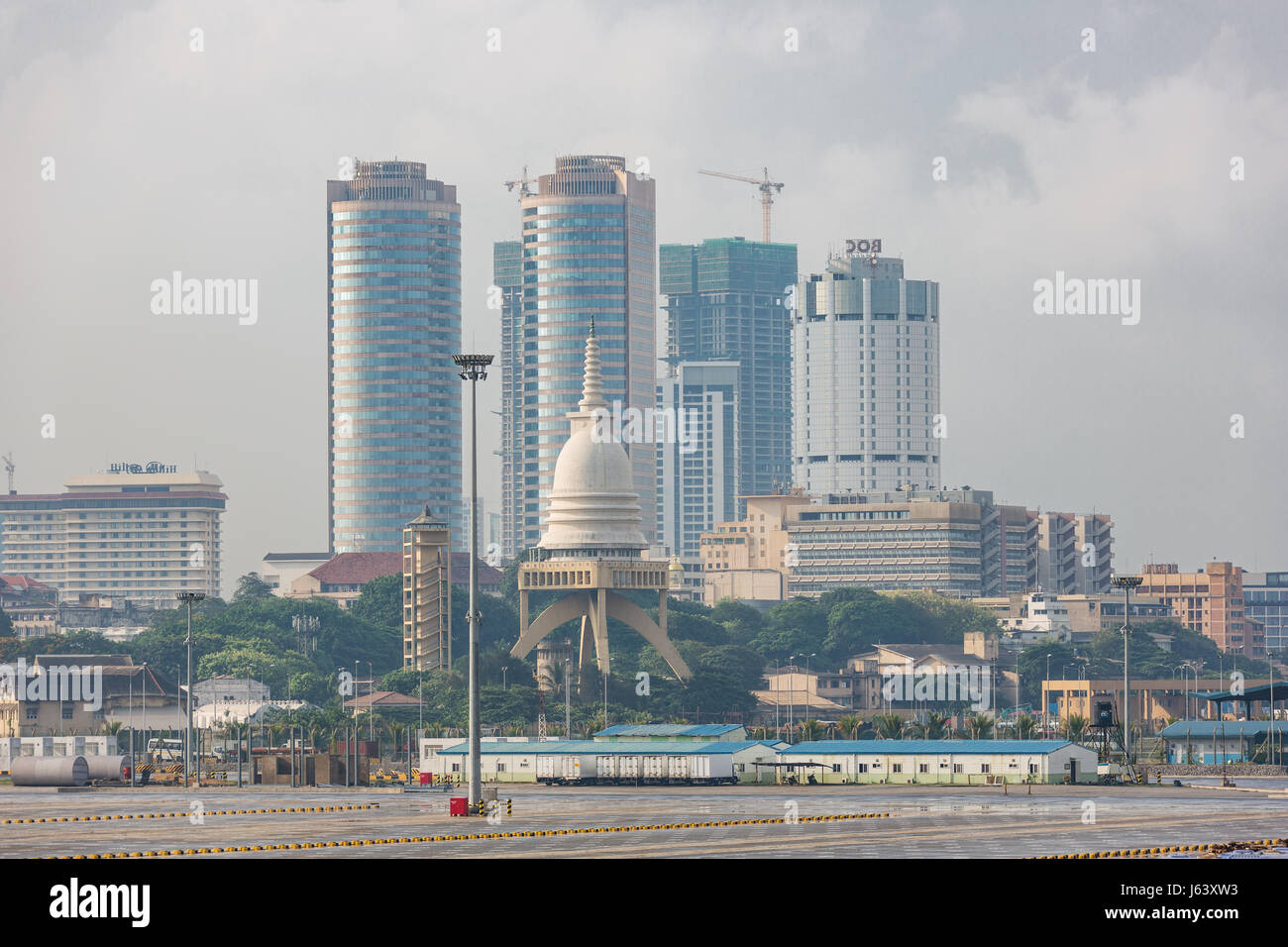Editorial: COLOMBO, SRI LANKA, April 7, 2017 - Colombo skyline with the Sambodhi Chaitya temple, seen from the harbor Stock Photo