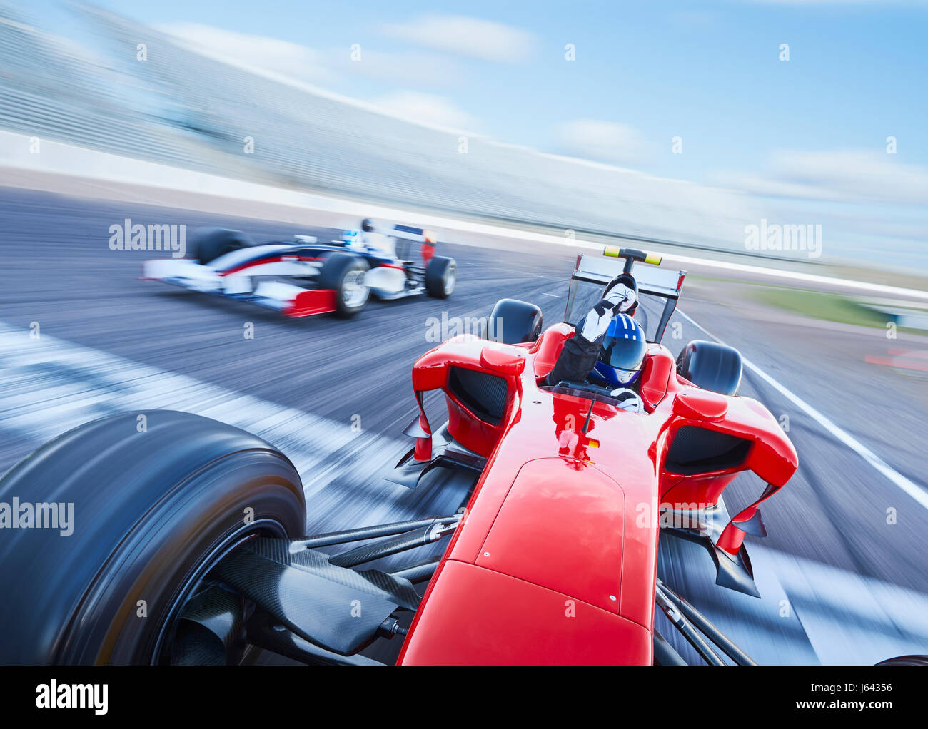 Formula one race car crossing finish line on sports track Stock Photo