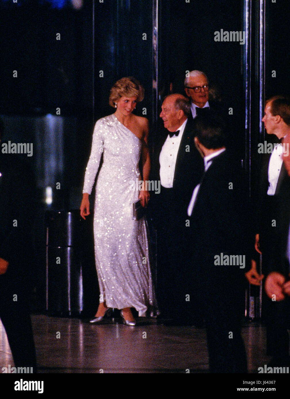 Princess Diana departs the National Gallery of Art in Washington, DC following an evening dinner and reception accompanied by Dr. Franklin Murphy, Board Chairman of the National Gallery of Art, and John Stevenson, President of the National Gallery of Art, in Washington, DC on November 11, 1985. Credit: Howard L. Sachs / CNP - NO WIRE SERVICE- Photo: Howard L. Sachs/Consolidated News Photos/Howard L. Sachs - CNP | usage worldwide Stock Photo
