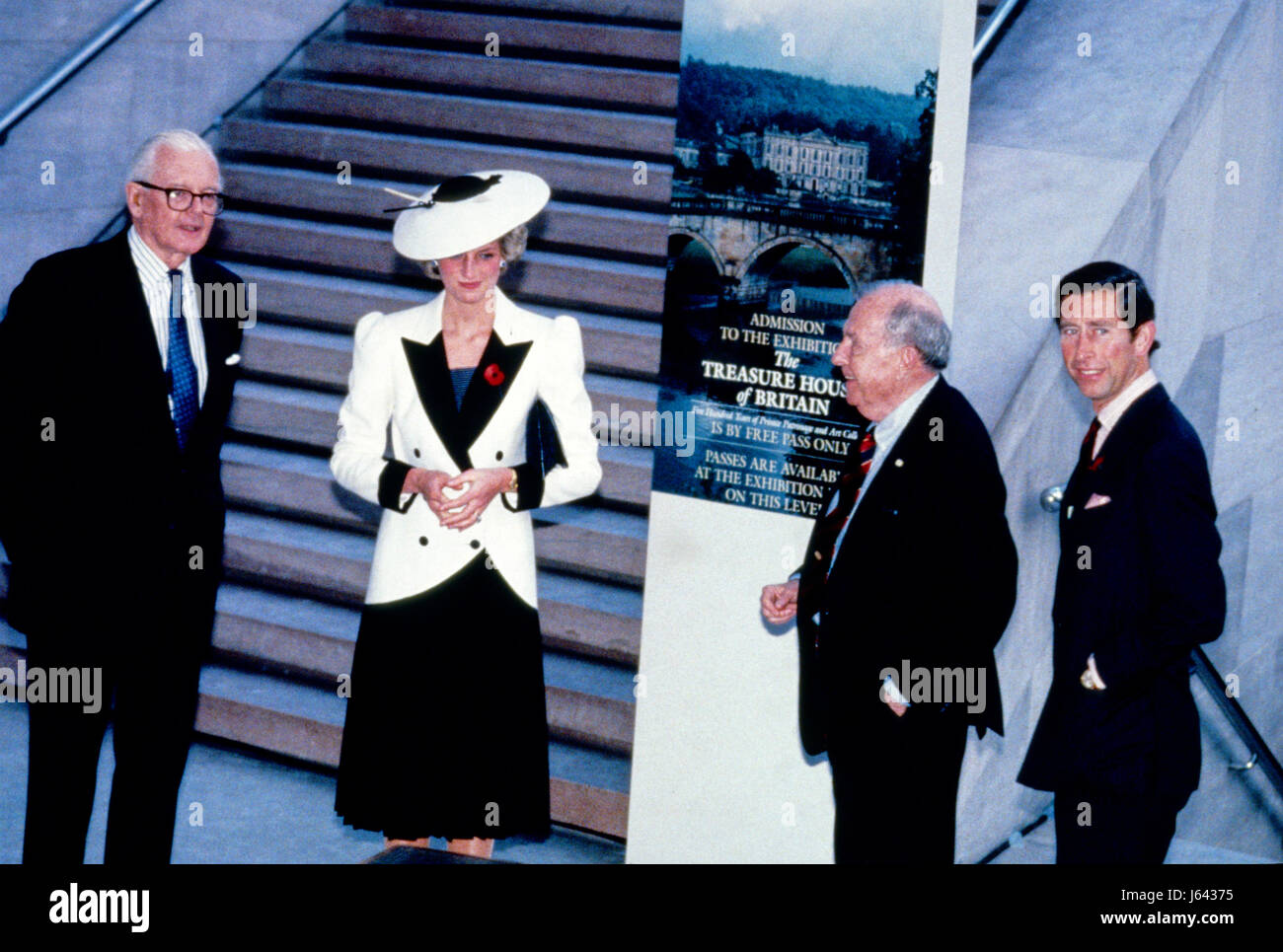 After signing the guest book of the National Gallery of Art, the Royal couple and their escorts were asked to pose for a group photo prior to touring the exhibit 'The Treasure Houses of Britain: 500 Years of Private Patronage and Art Collecting' at the National Gallery of Art in Washington, DC on November 11, 1985. From left to right: John Stevenson, President of the National Gallery of Art; Princess Diana; Dr. Franklin Murphy, Board Chairman of the National Gallery of Art; and Prince Charles. Credit: Peter Heimsath / Pool via CNP - NO WIRE SERVICE- Photo: Peter Heimsath/Consolidated News Phot Stock Photo