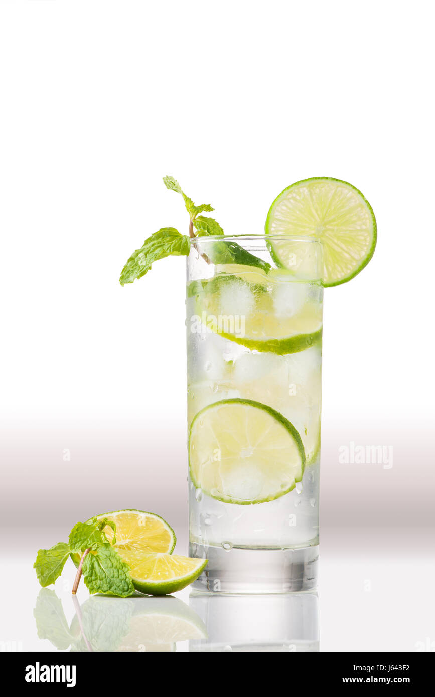 Full glass of water with lemon and mint isolated on white background Stock Photo