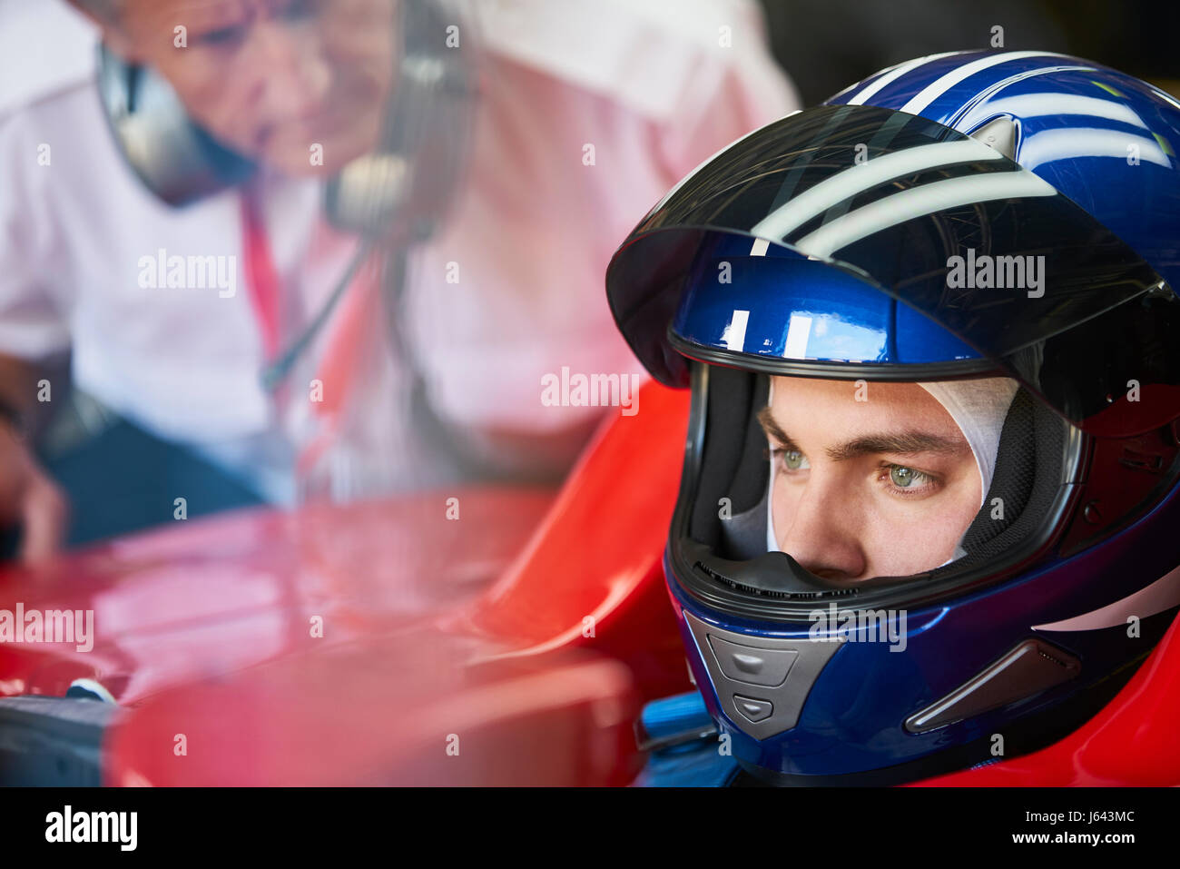 Focused formula one race car driver wearing helmet Stock Photo Alamy