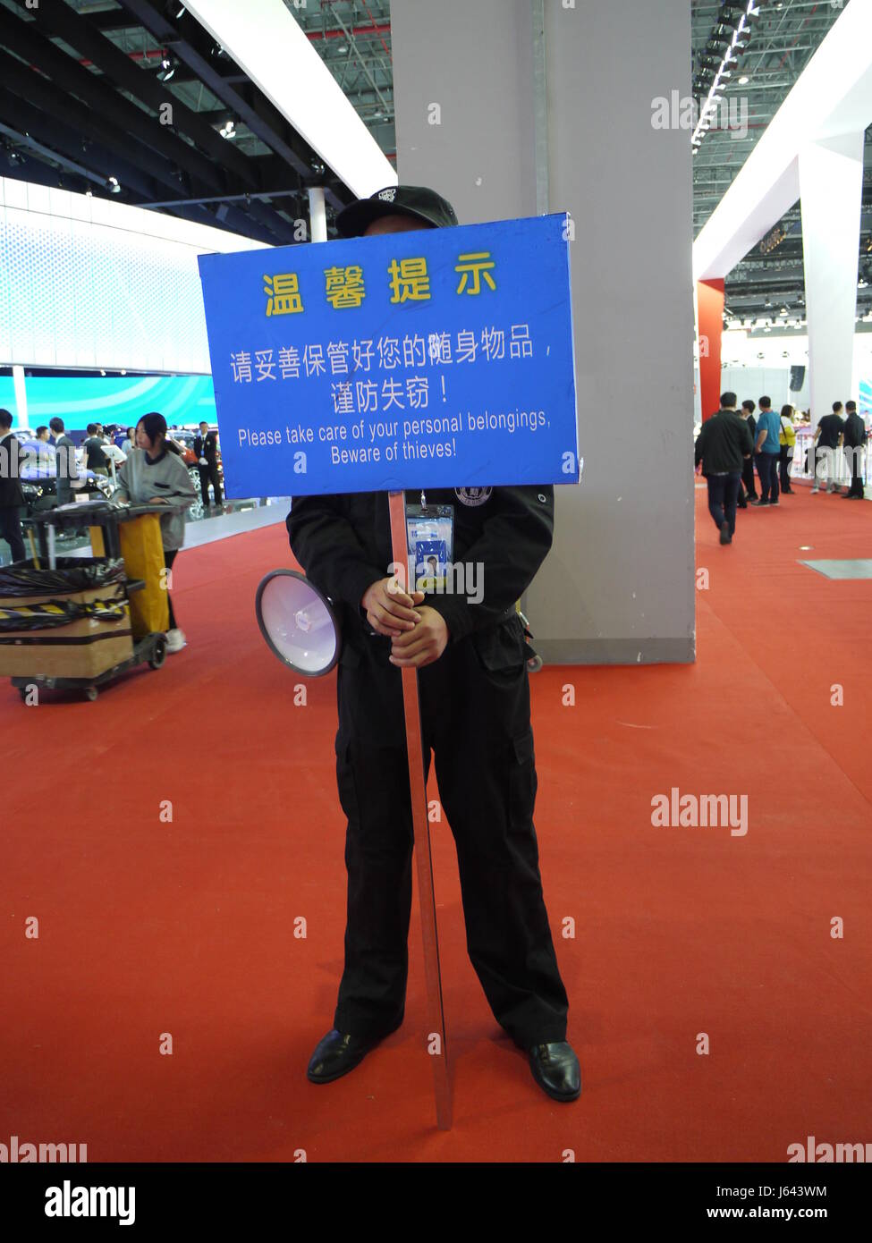 In Shanghai Motor Show, warning against thieves issued by the staff Stock Photo