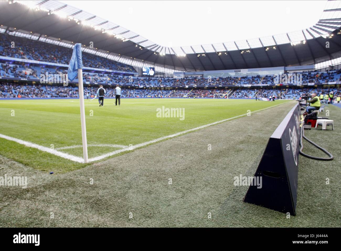 ADVERTISING BOARDS MOVED TO RE MANCHESTER CITY V STOKE CITY F ETIHAD STADIUM MANCHESTER ENGLAND 01 January 2013 Stock Photo