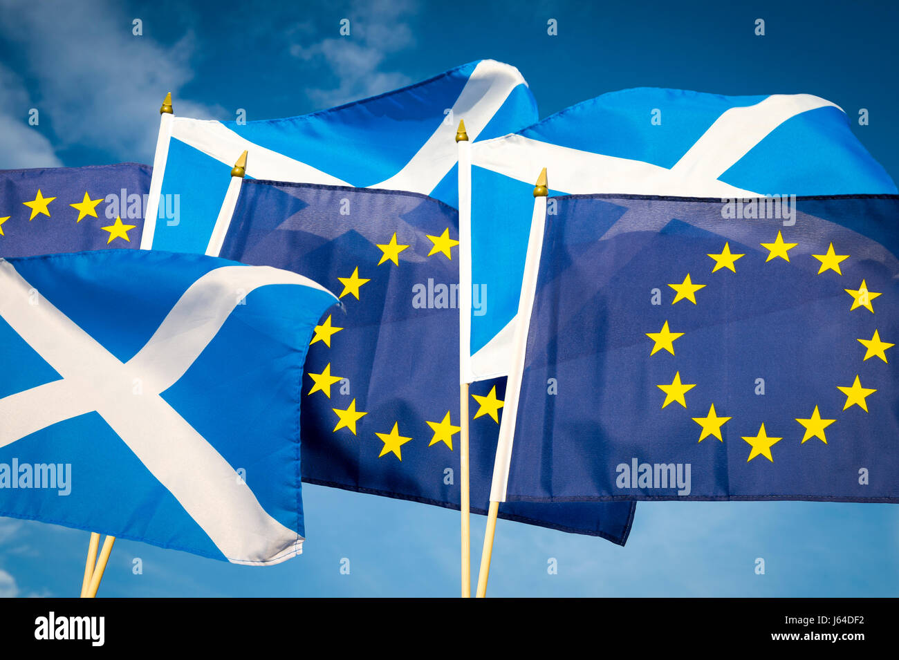 Flags of Scotland and the European Union flying together in the spirit of cooperation as Scotland considers its fate in the Brexit proceedings Stock Photo