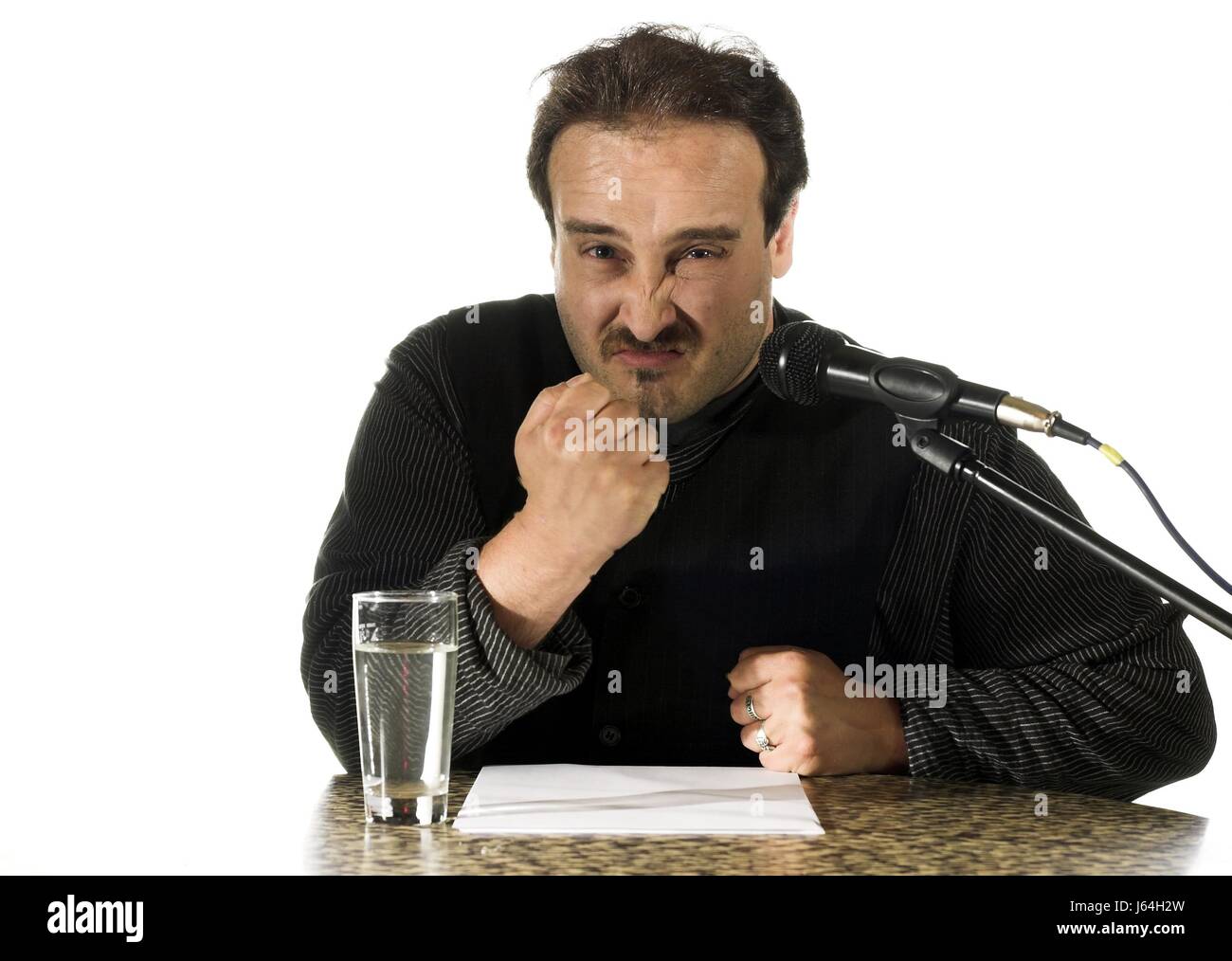 orator microphone angrily annoying agression aggression speech man seminar loud Stock Photo
