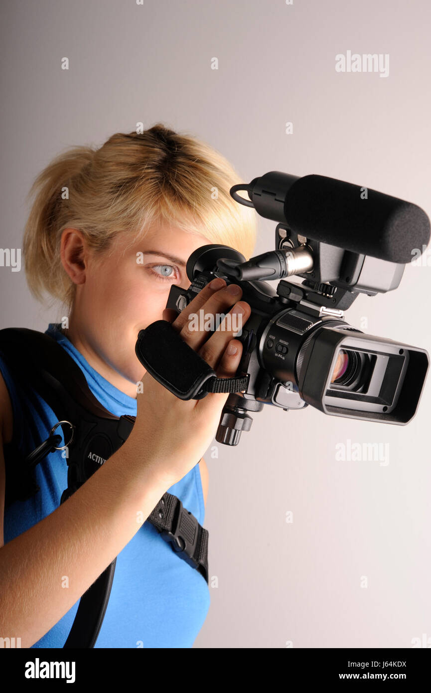 woman education absorb video recording film movie video camera seminar inside Stock Photo