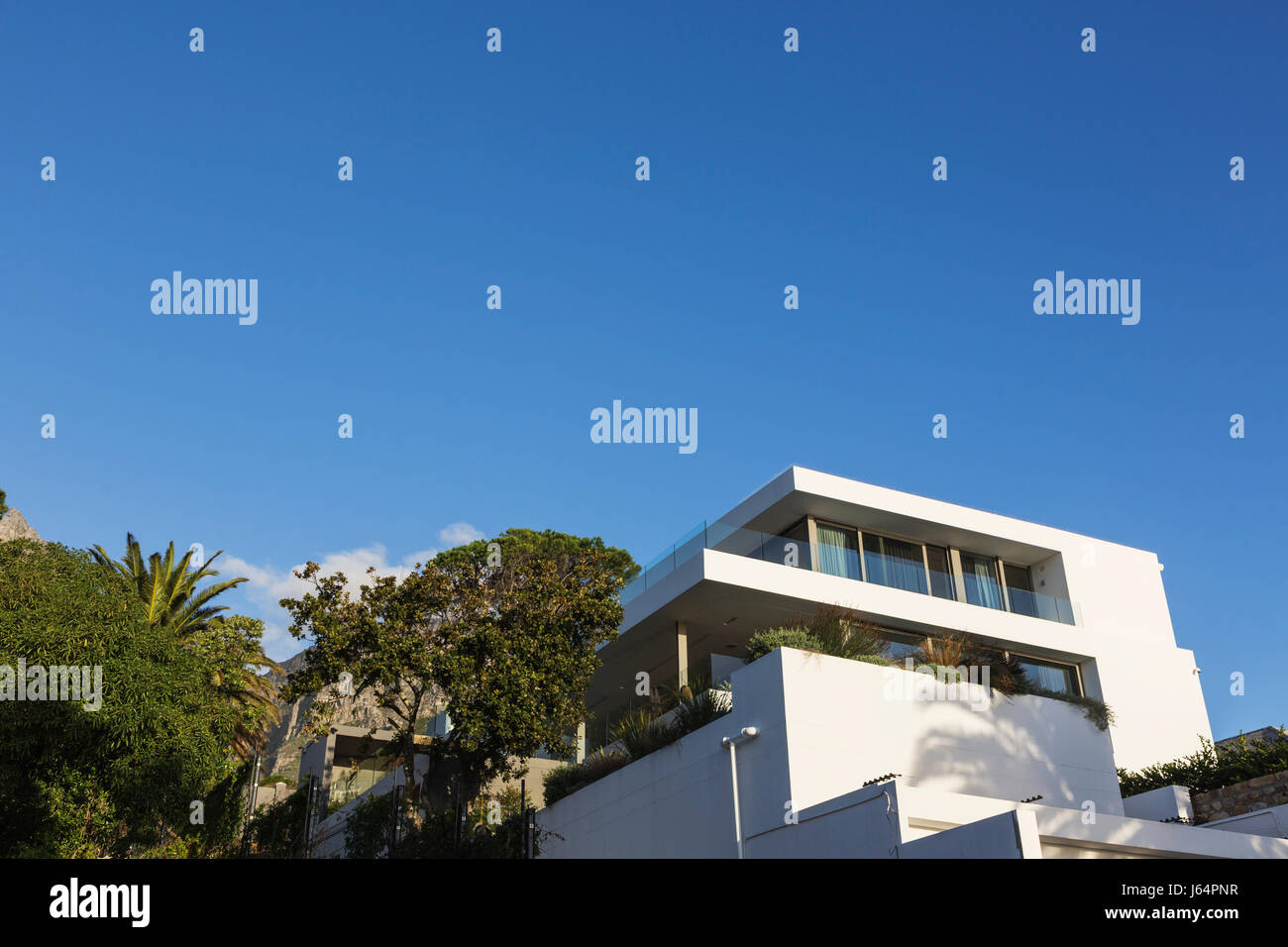 Modern luxury white home showcase exterior under blue sky Stock Photo