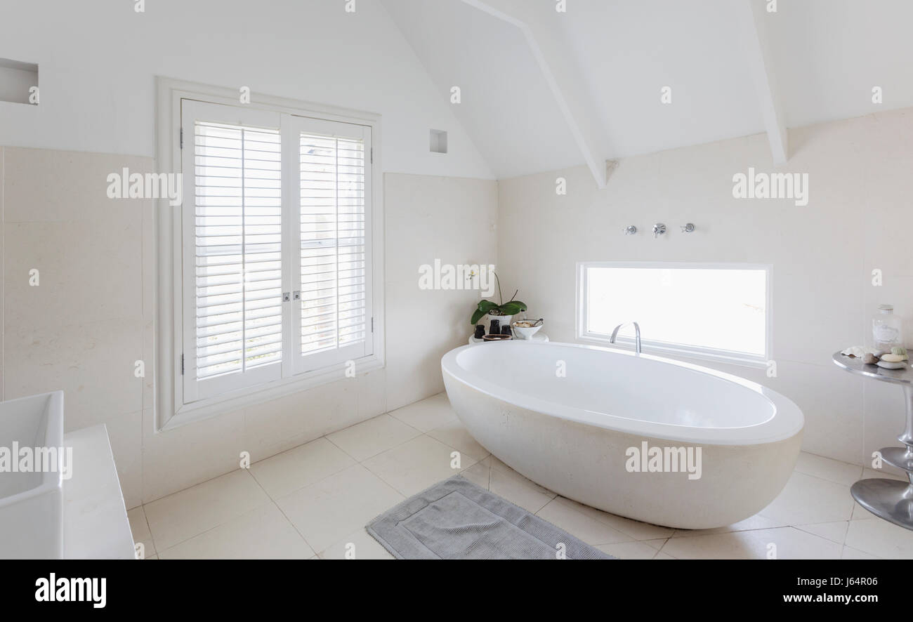 Modern luxury white round soaking bathtub in bathroom Stock Photo Alamy