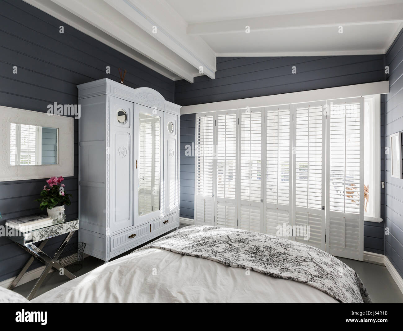 Luxury Home Showcase Bedroom With White Wood Shutters And