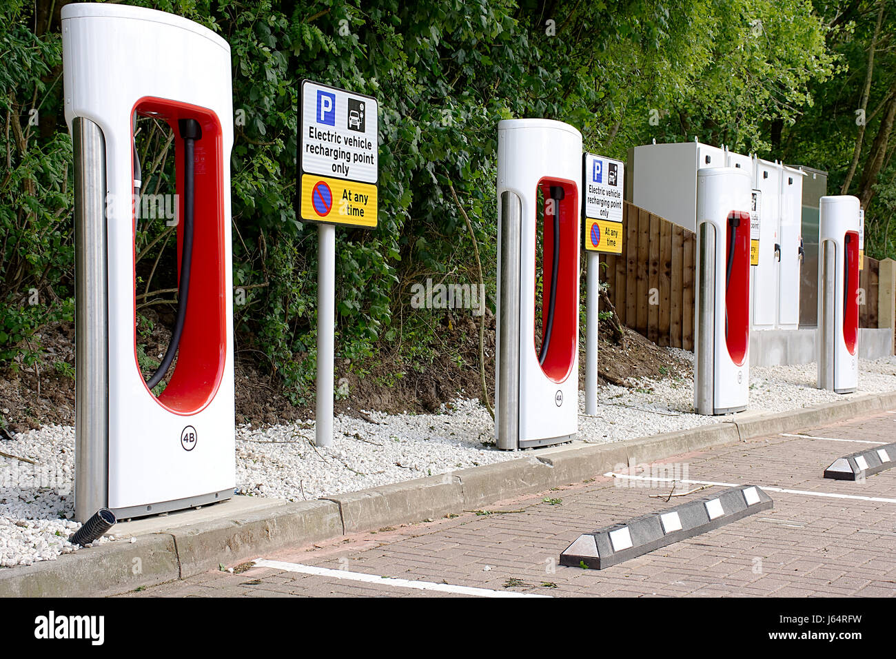Electric car charging station on motorway services in Oxfordshire United Kingdom.Electric car charging points,Uk.Energy Uk.Tesla car chargers. Stock Photo
