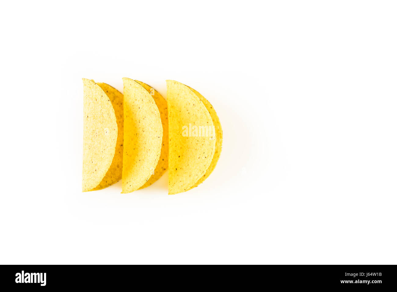 Yellow corn taco shells on a white background Stock Photo - Alamy