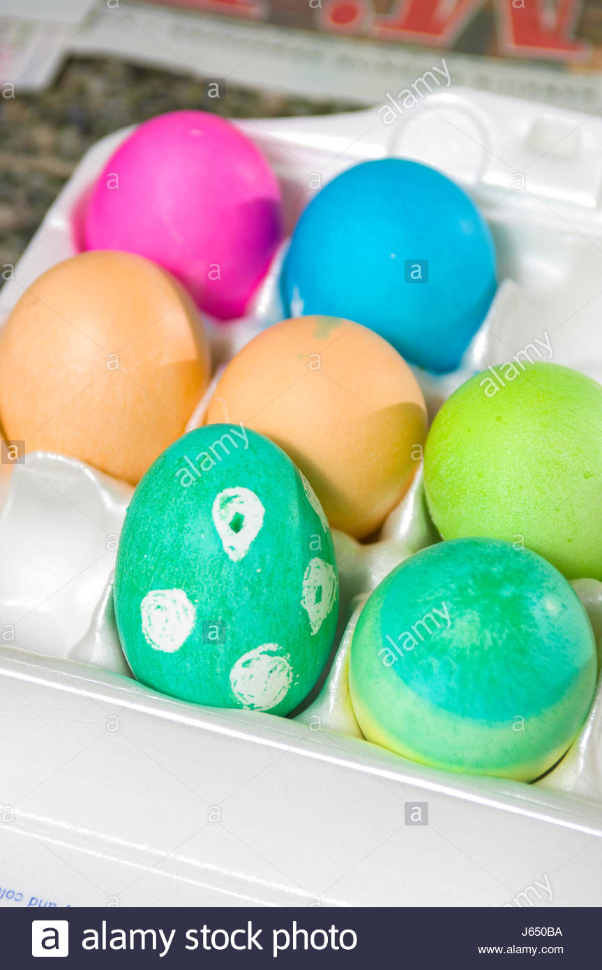 Children At Home In Kitchen Dyeing And Decorating Hard Boiled Eggs