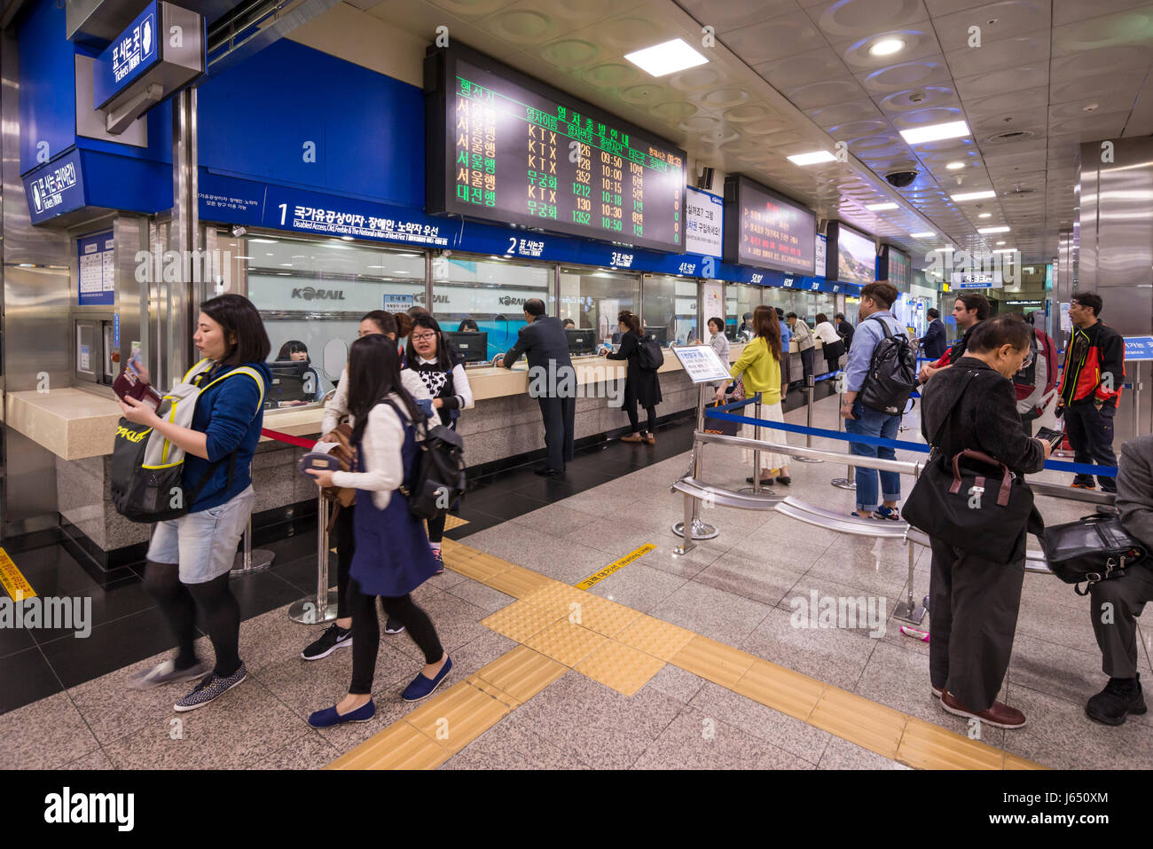 Passengers in queues at the Ticket Office at Busan Railway Station Concourse, Busan Gwangyeoksi, South Korea Stock Photo