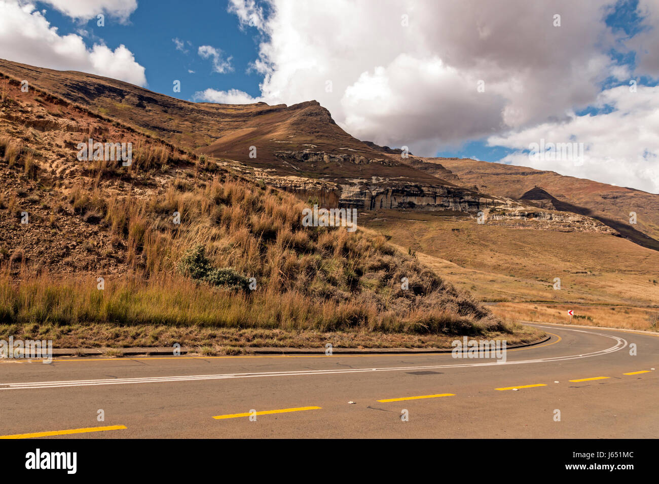 Curved Empty Rural Asphalt Road Running Through Dry Winter Mountain Stock Photo Alamy