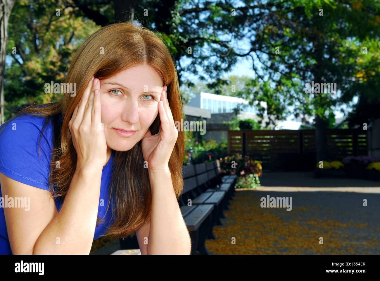 woman sad unhappy put sitting sit forties stressed humans human beings people Stock Photo