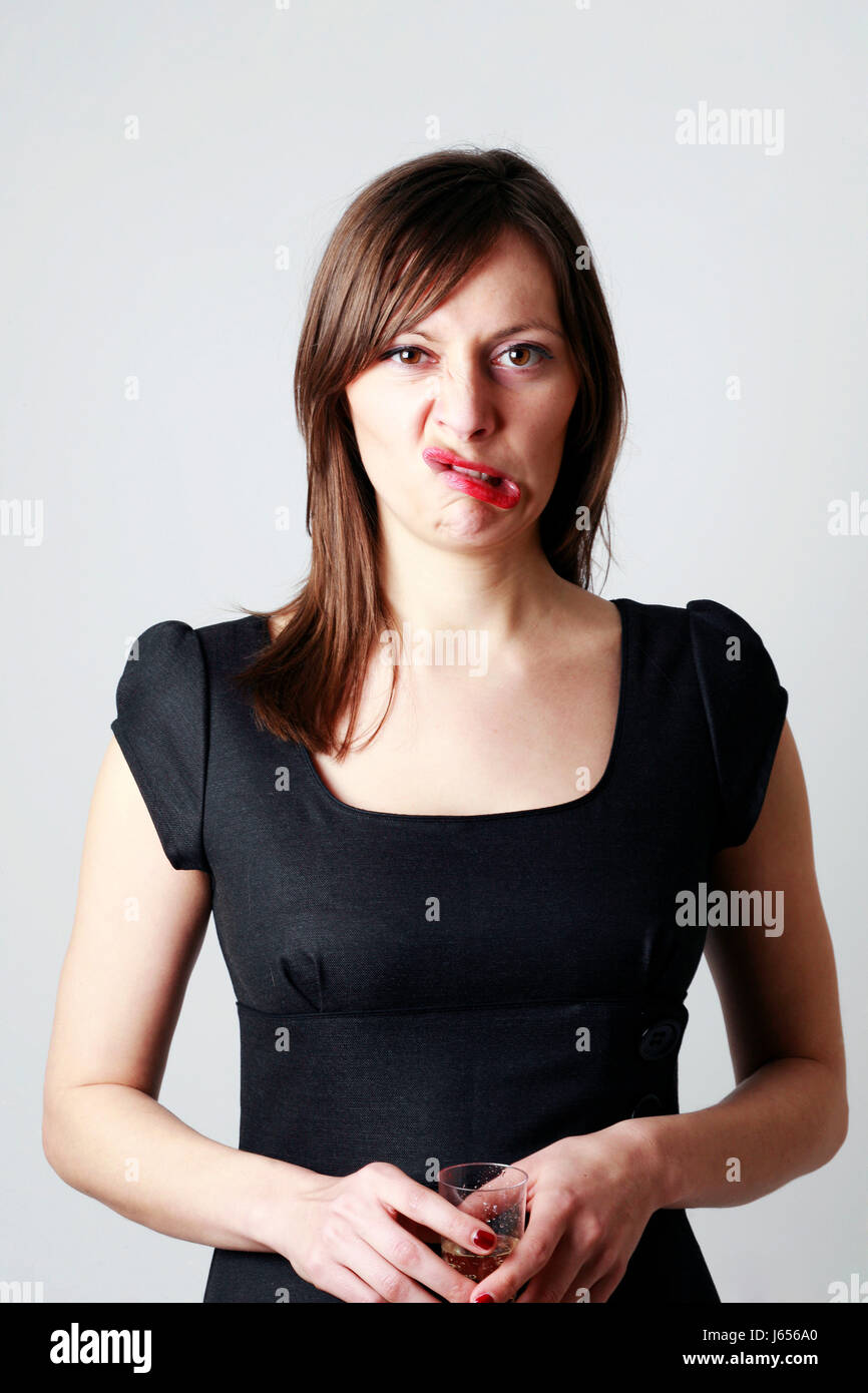 young woman grimaces Stock Photo - Alamy