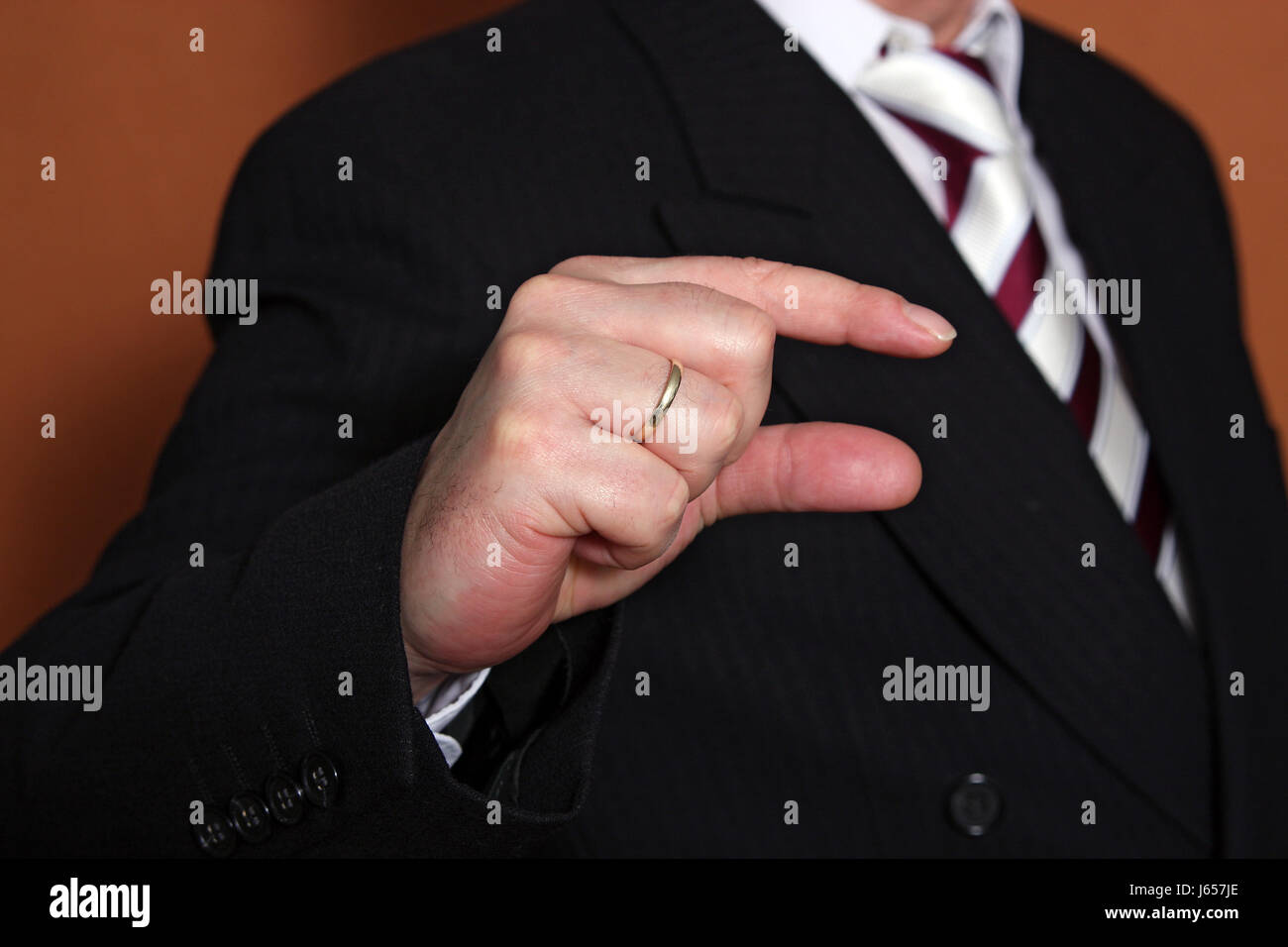 indicate show hand finger small tiny little short appraise man thumbs ...