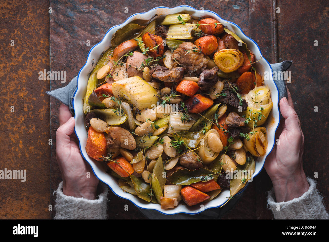 Woman holding her hands ready dish with kasul Stock Photo
