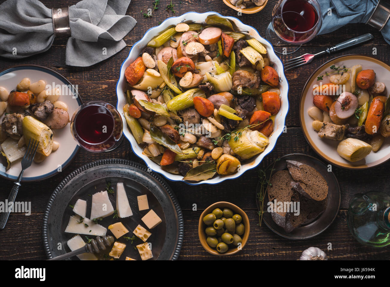 Kasul, cheese, wine, vegetables on the table closeup Stock Photo