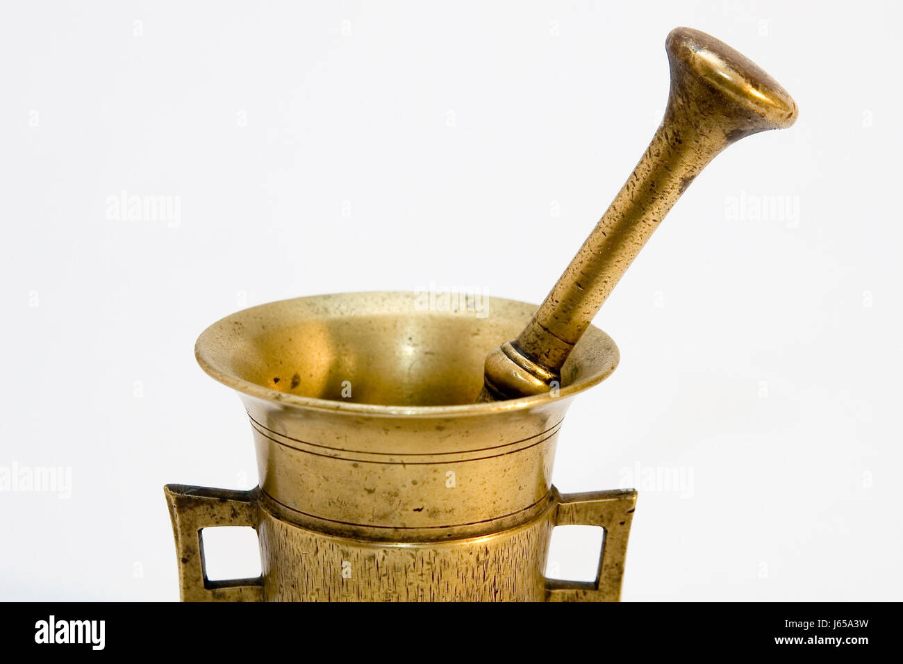 metal brass mortar pestle spice isolated antique golden metal brass