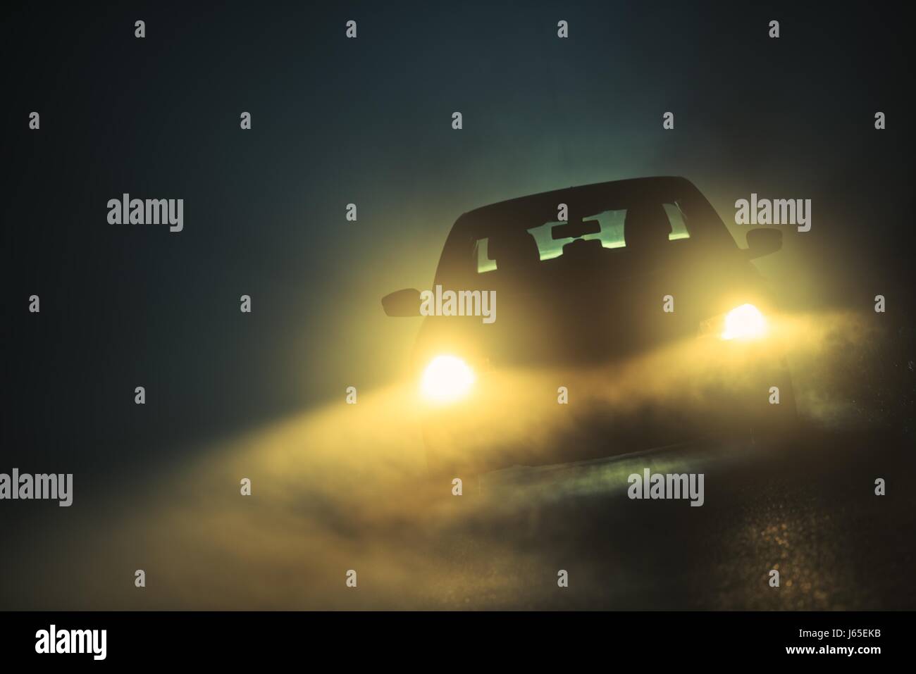 Car Driving in Dense Fog. Dangerous Road Conditions. Night Time Driving