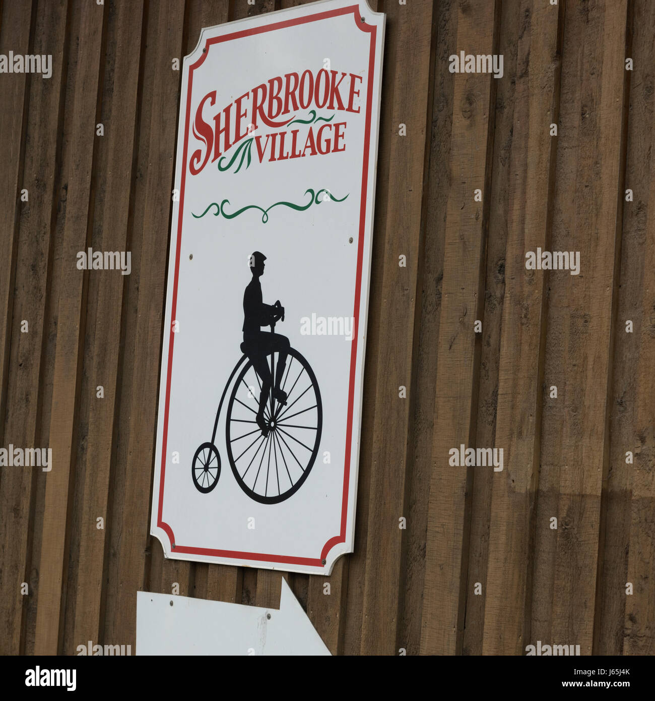 Sign on wooden wall, Sherbrooke, Nova Scotia, Canada Stock Photo