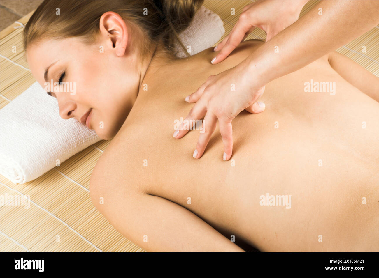 young woman massaging Stock Photo