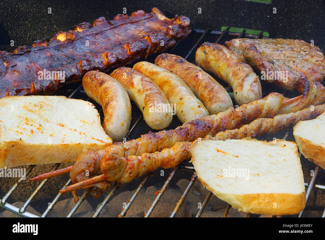 fish sausage trout grill barbecue barbeque meat food aliment fish boil cooks Stock Photo