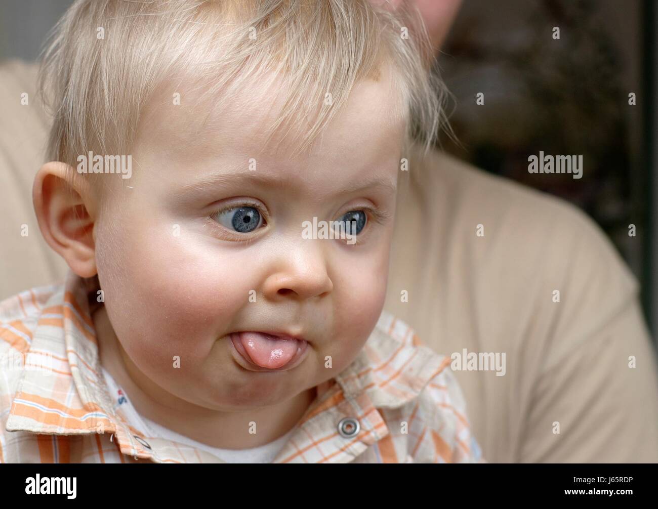 Very young baby poke out tongue hires stock photography and images Alamy