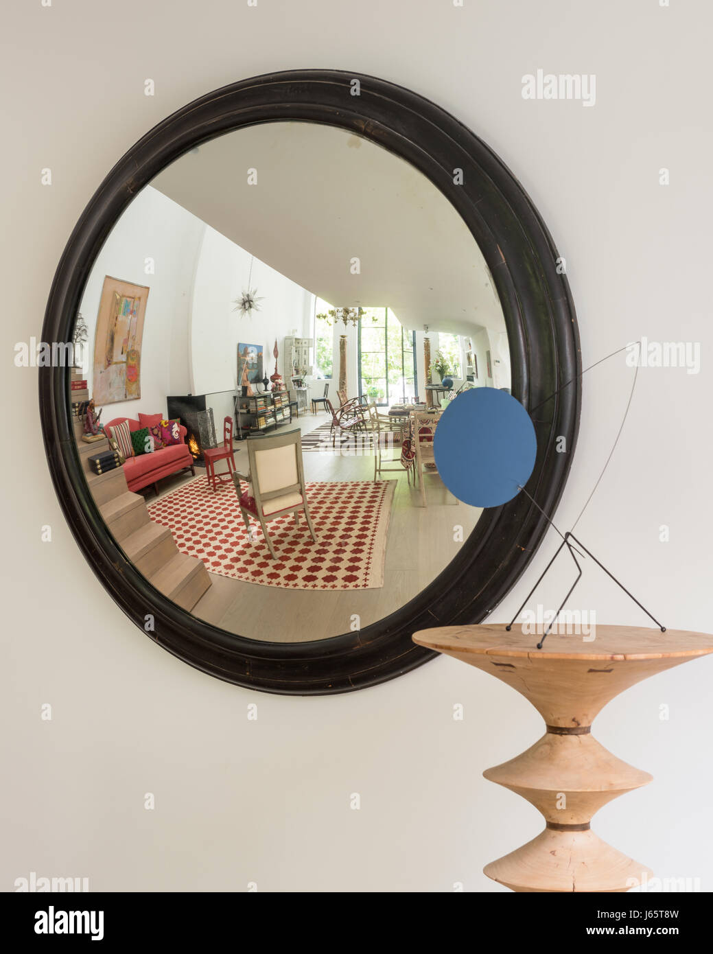 Large convex mirror telescopes living space of Brussels atelier of Isabelle de Borchgrave Stock Photo
