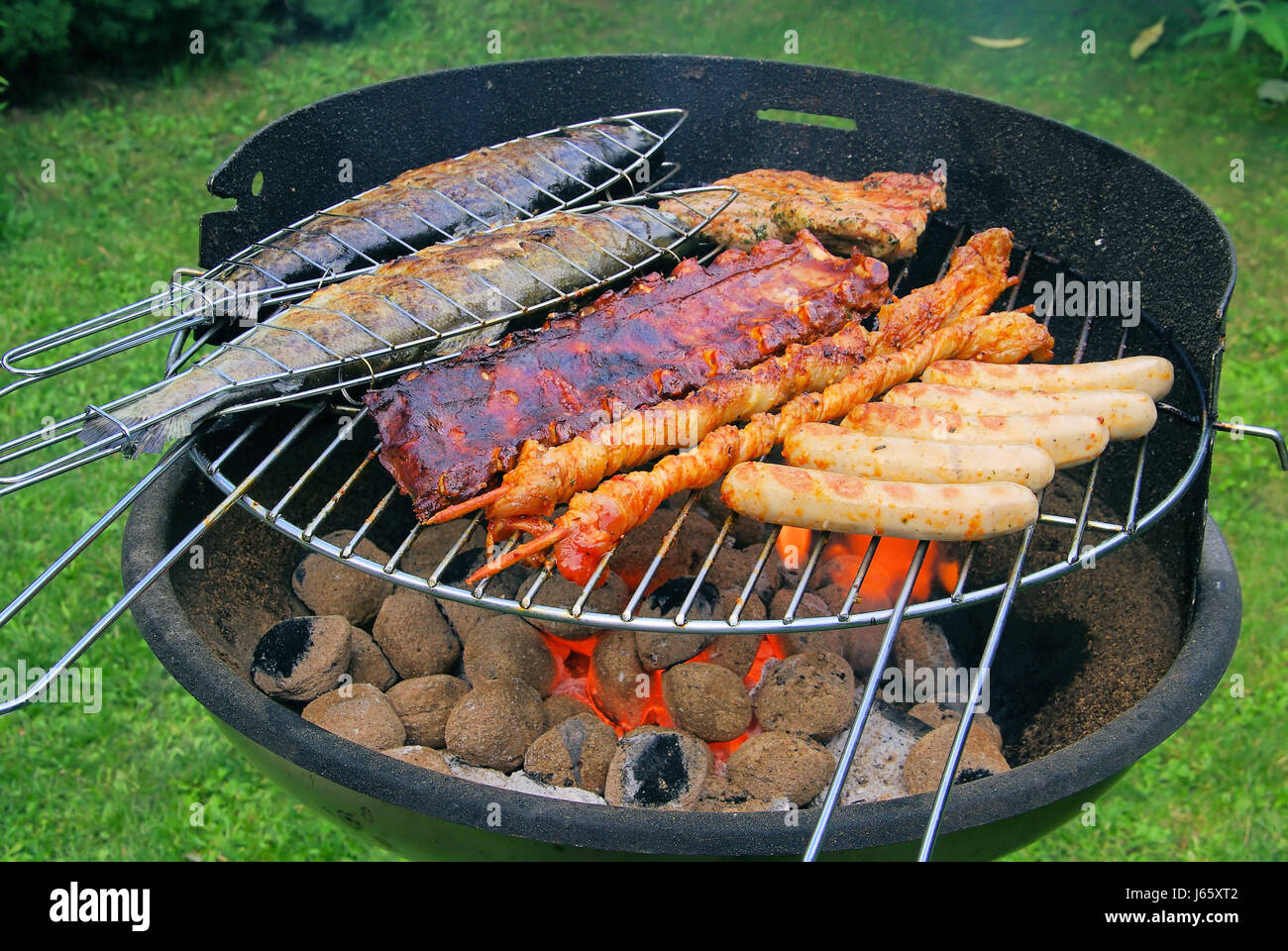 fish sausage trout grill barbecue barbeque meat food aliment fish boil cooks Stock Photo