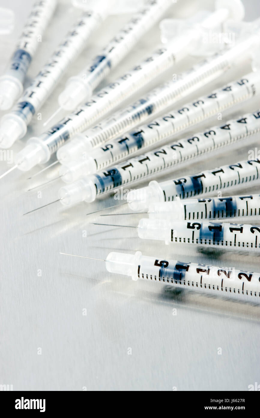 medicinally medical needle injection vaccine syringe close glass chalice Stock Photo