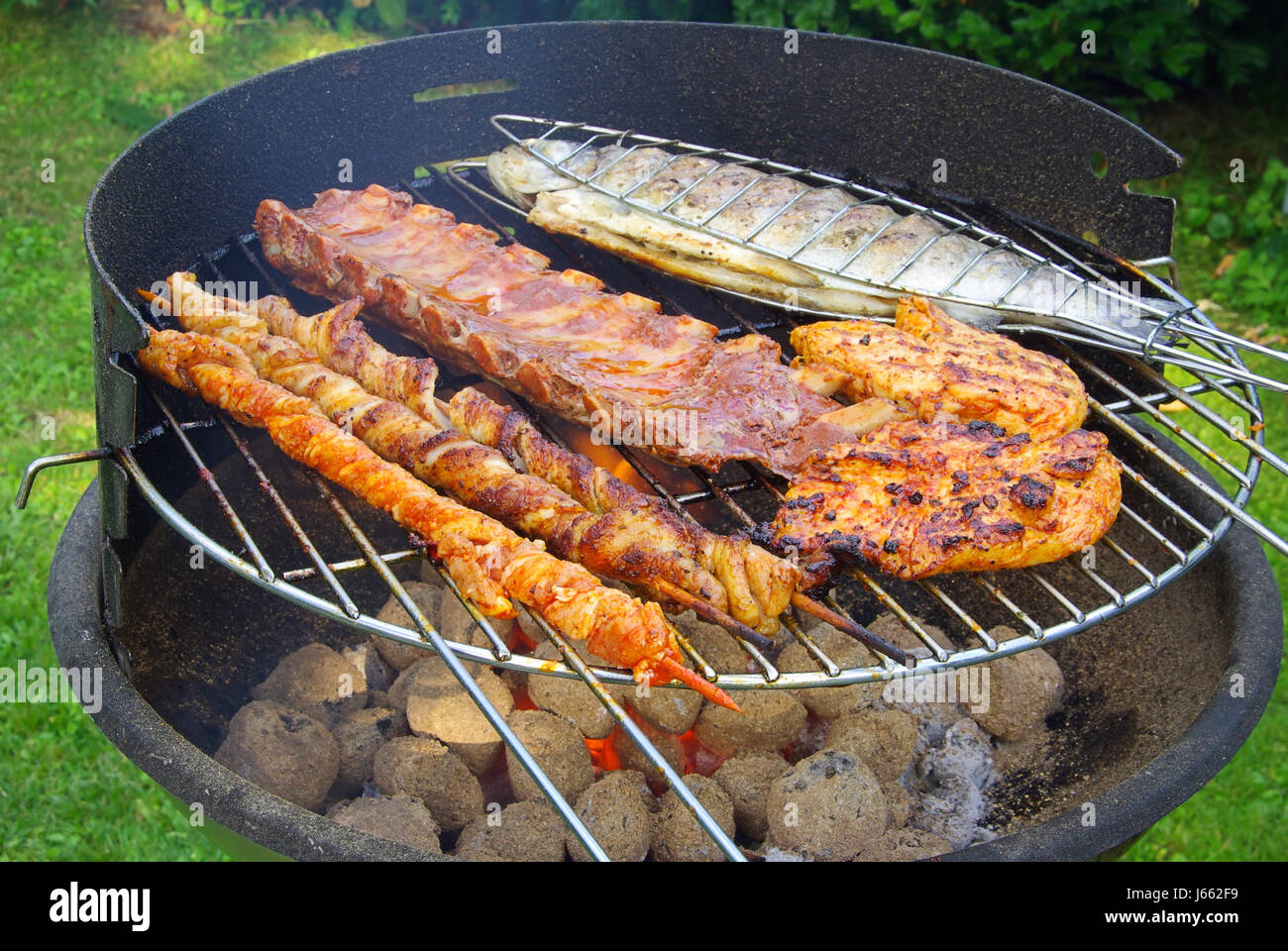 fish trout grill barbecue barbeque meat food aliment fish boil cooks boiling Stock Photo