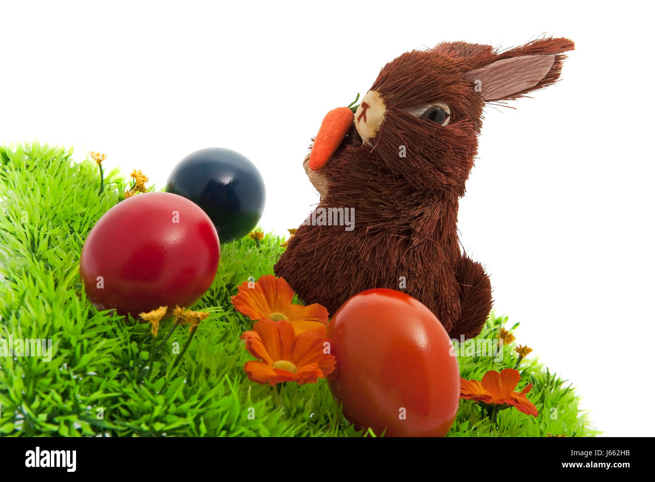 easter bunny in the grass with colored eggs Stock Photo - Alamy