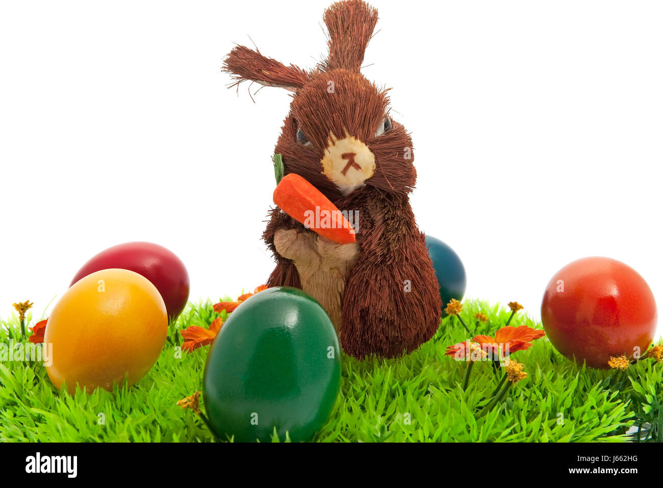 easter bunny in the grass with colored eggs Stock Photo - Alamy