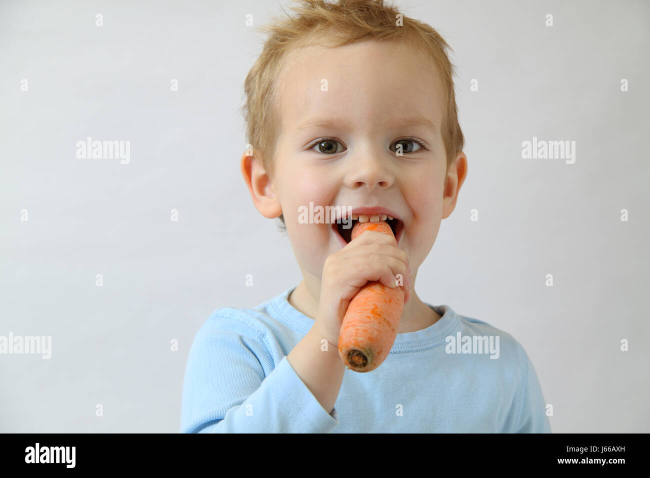 vegetable carrot young younger child eating eat eats nutrition toddler