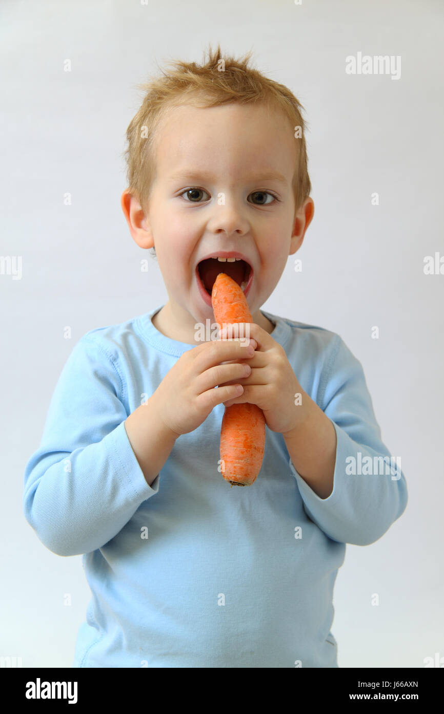 vegetable carrot young younger child eating eat eats nutrition toddler