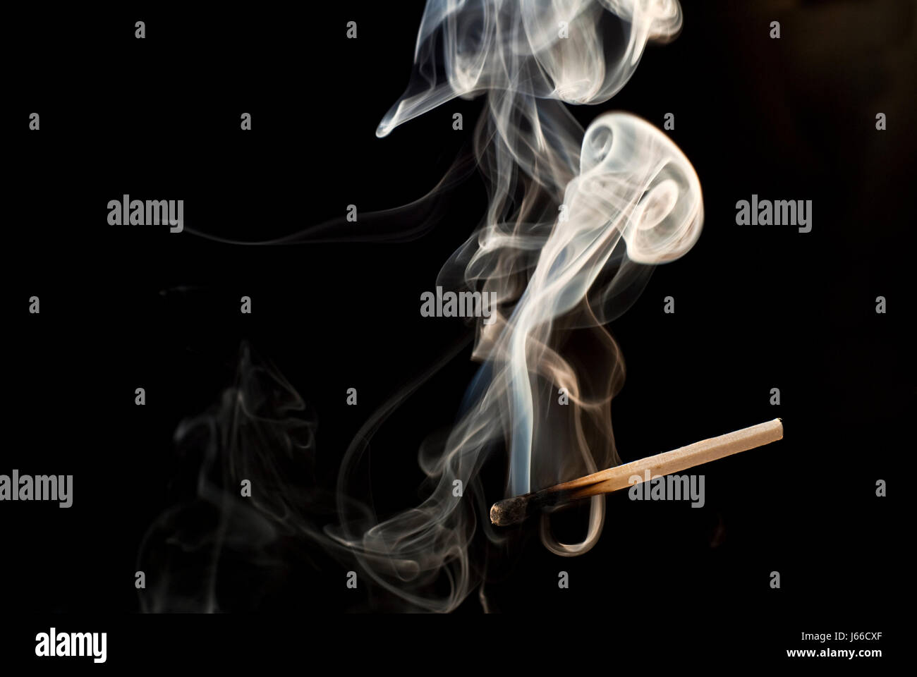 out match smoke smoking smokes fume wood fire conflagration out match blown out Stock Photo
