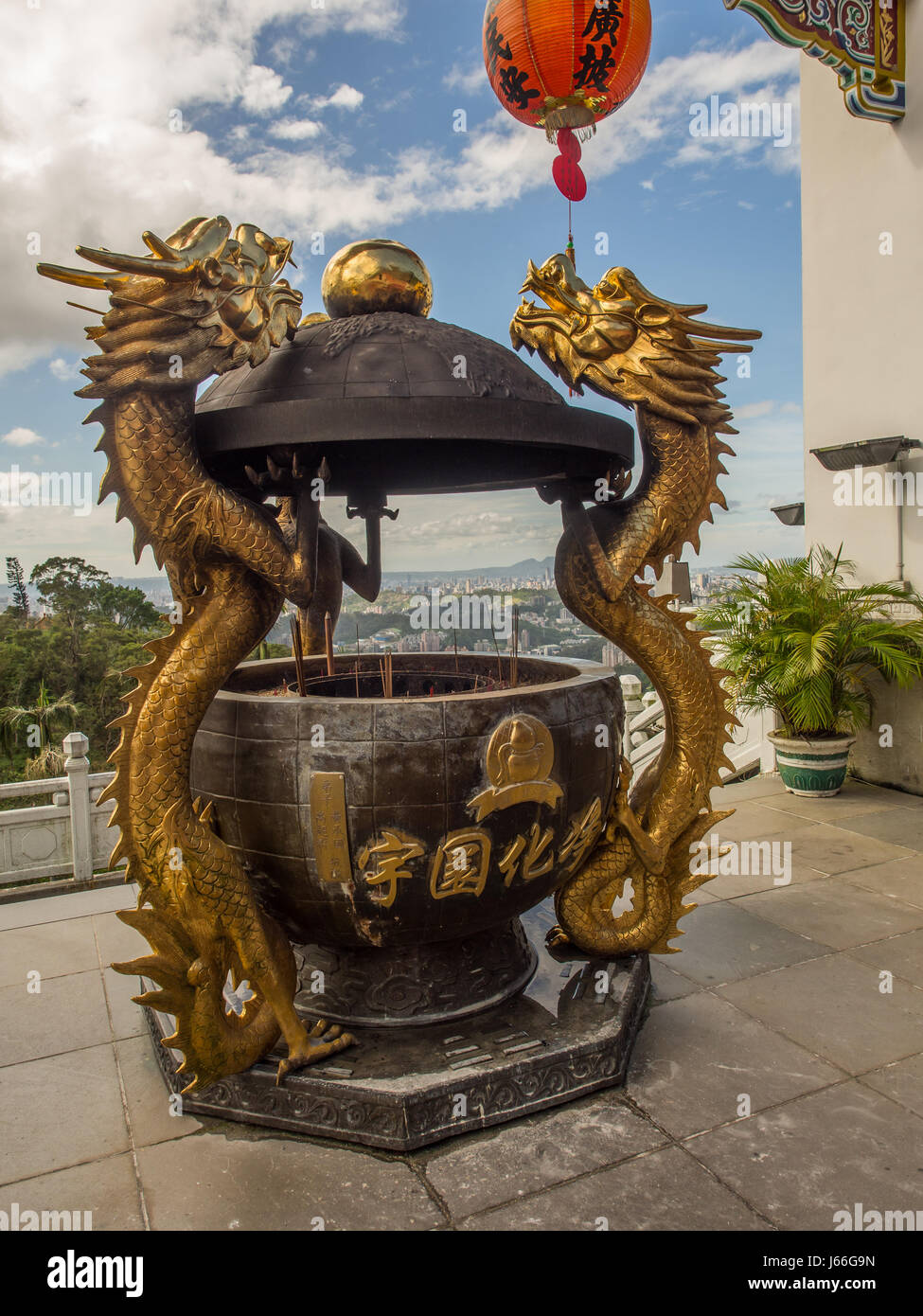 Maokong, Taiwan - October 19, 2016: A golden censer with two handles in the shape of dragons before the Chih Nan Temple on the hills of Maokong  in Ta Stock Photo