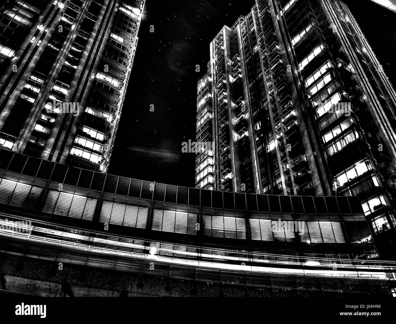 London,  England - December 08, 2015: The metro line, starry sky and skyscrapers of  Canary Wharf in the background Stock Photo