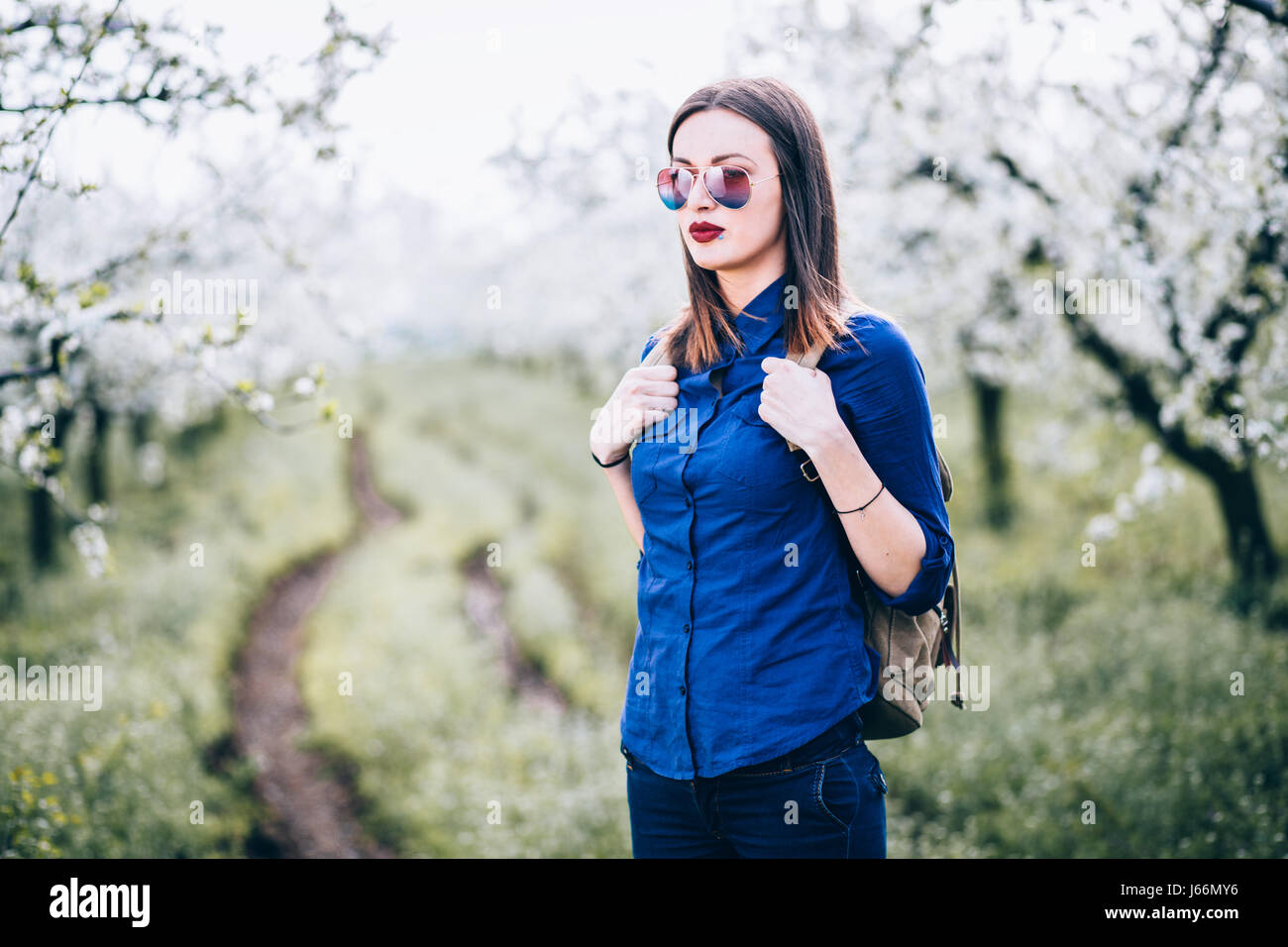 Young woman walking in nature Stock Photo - Alamy