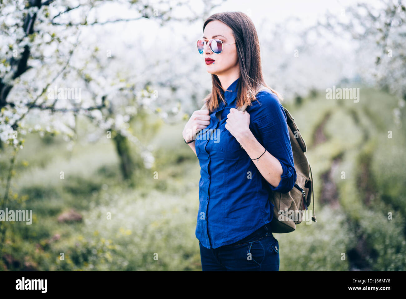 Young woman walking in nature Stock Photo - Alamy