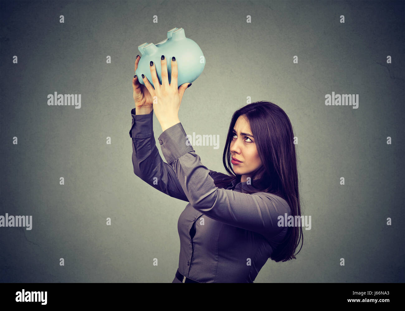 Young worried woman with empty piggy bank Stock Photo - Alamy